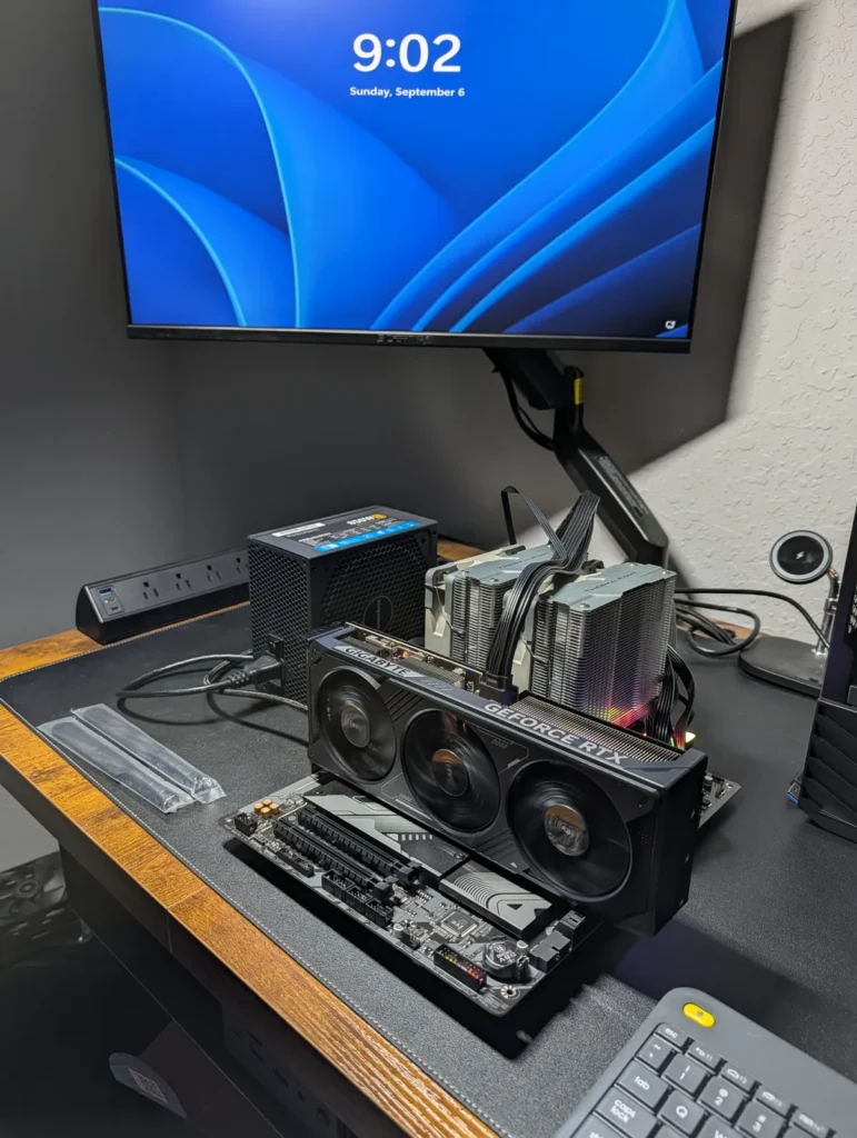Custom PC build being tested with its motherboard and graphics card
